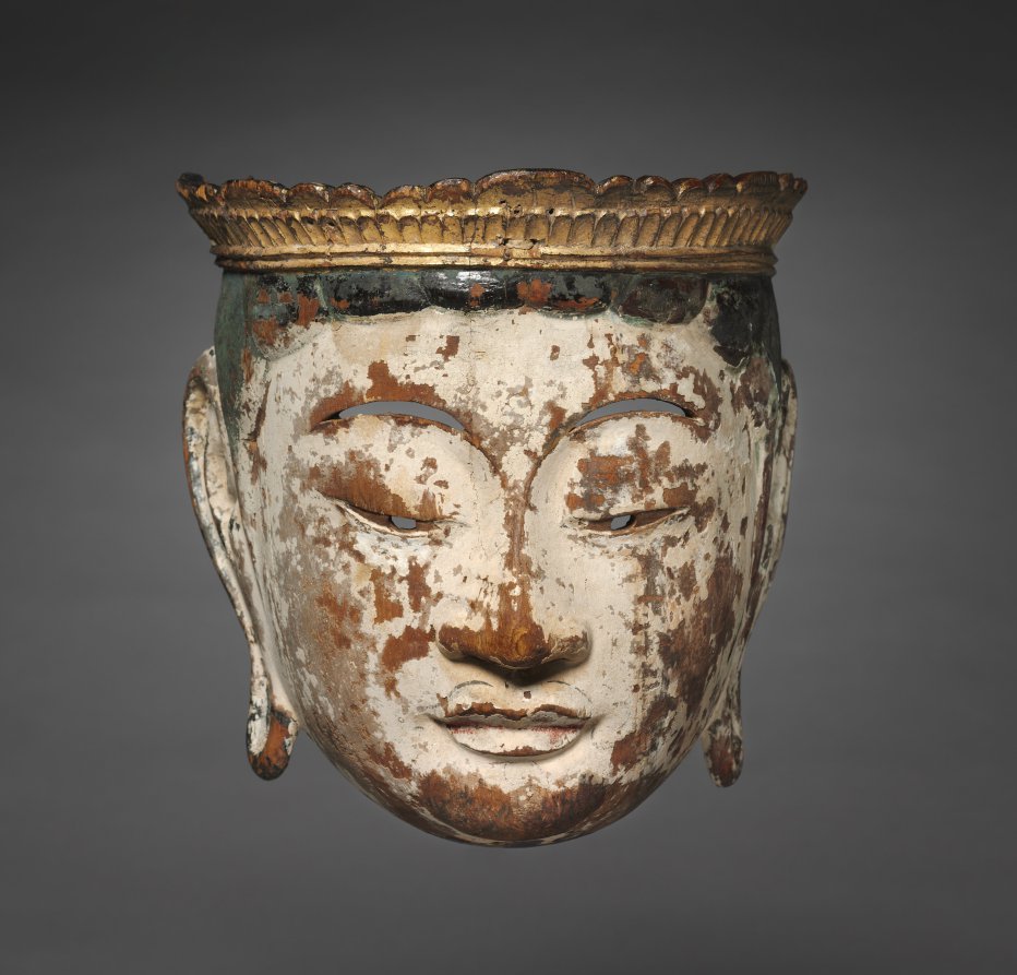 Late-Heian processional bodhisattva face-mask, lacquered painted wood, late 1100s, 22 × 16 cm. Worn white paint, narrow eye-slits, gold petaled crown.