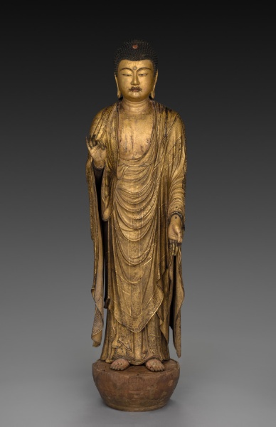 Kamakura standing Amida in gilt wood, 1269, 94.6 cm. Right hand raised, left lowered in raigō-in welcoming mudra; plain dark-wood lotus base.