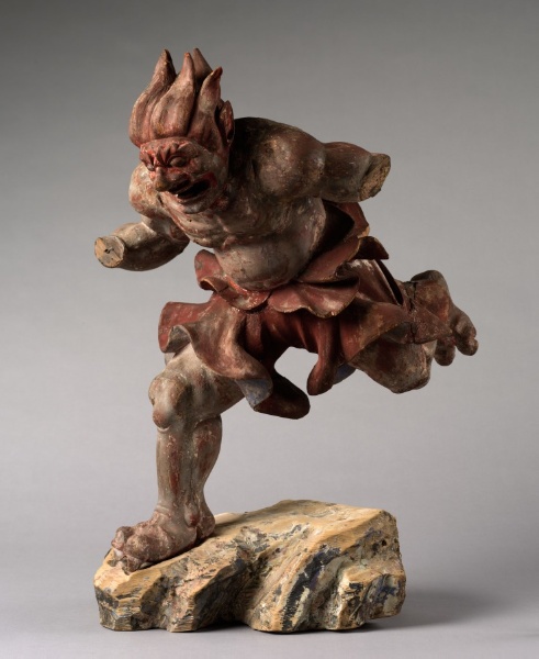 Kamakura 14th-c. wood Raijin, 67 cm, with traces of red and black pigment. Wild-haired demon mid-stride, bared fangs, flame-tongue hair; metal clasp marks lost drum-ring.