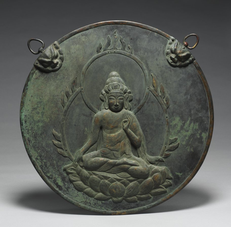 Nanbokuchō bronze kakebotoke with repoussé seated Kannon, mid–late 1300s, 52.5 cm diameter. Princely crown; left hand in vitarka mudra; verdigris surface.