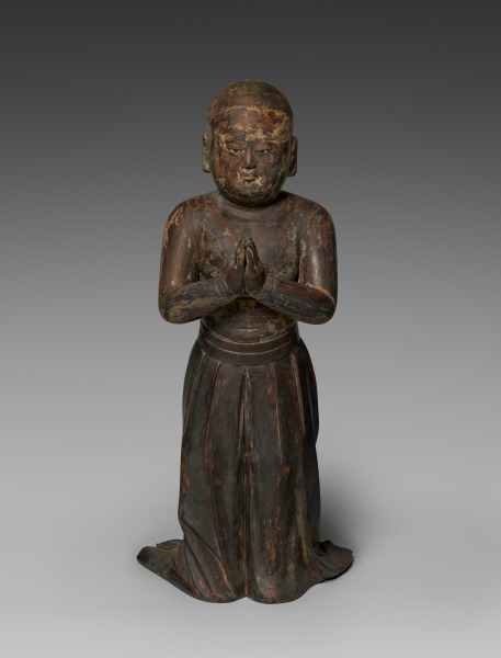Kamakura early-1300s standing wood Shōtoku Taishi as a two-year-old, 69 cm, with rock-crystal eyes. Bare-chested in a long pleated skirt; palms in gasshō.