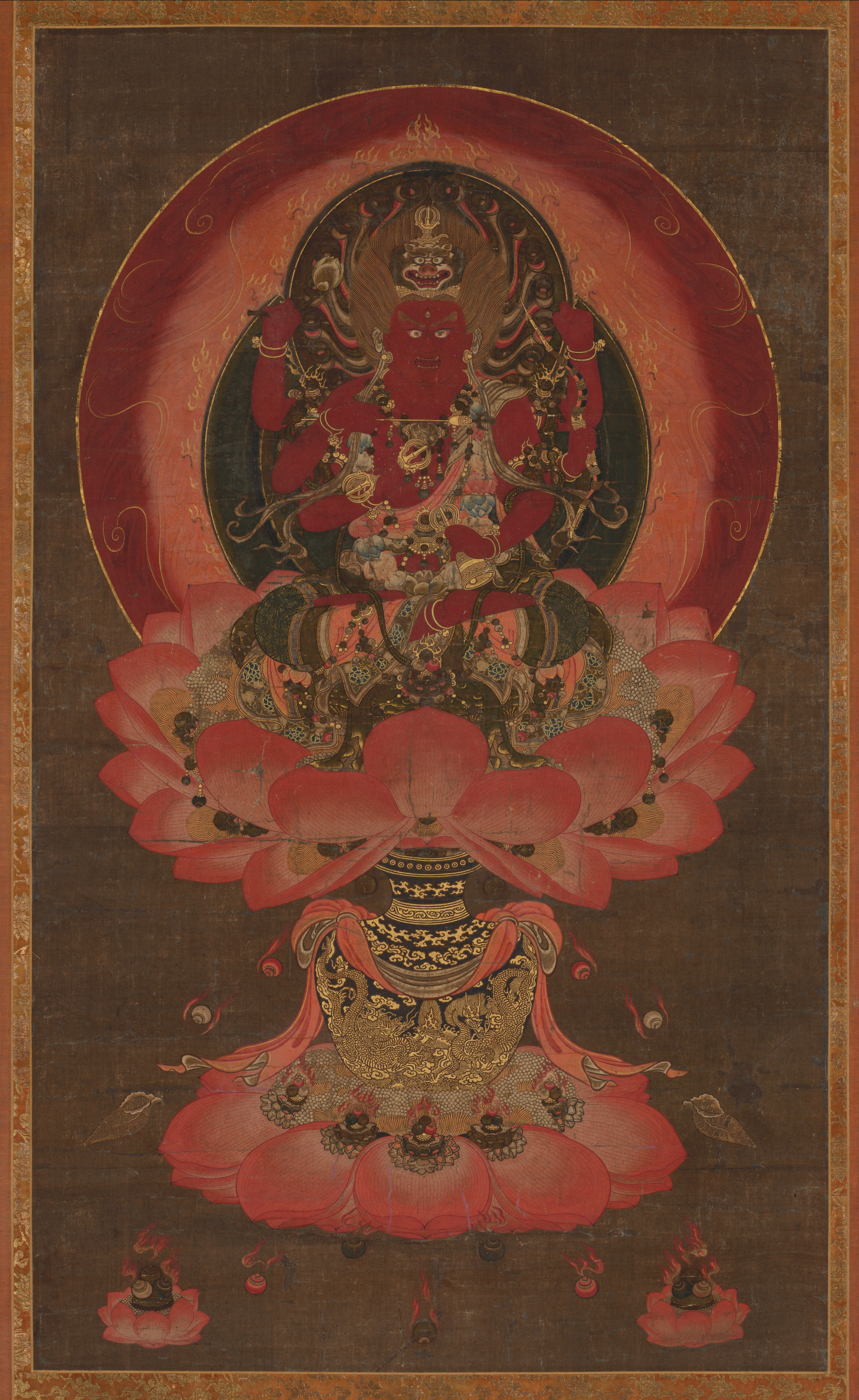 Kamakura–Nanbokuchō hanging scroll, ink colour gold on silk, 1300s, 102 × 60 cm. Six-armed red Aizen Myōō on a vase-supported lotus throne; lion crown.