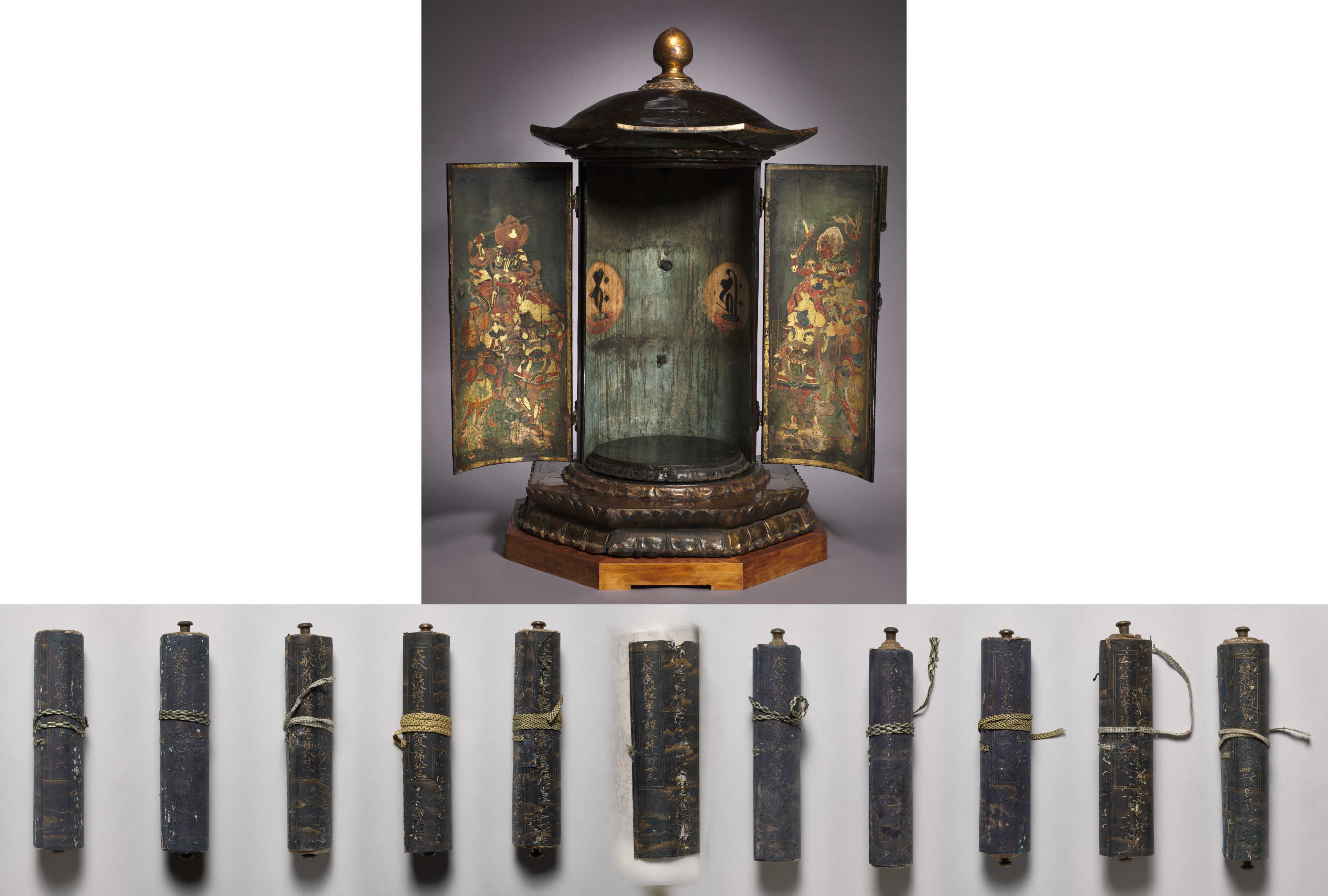 A pagoda-roofed black-lacquered cylindrical cabinet with a gilt finial, two open doors painted with armored guardian deities in red and gold, an interior back wall bearing two