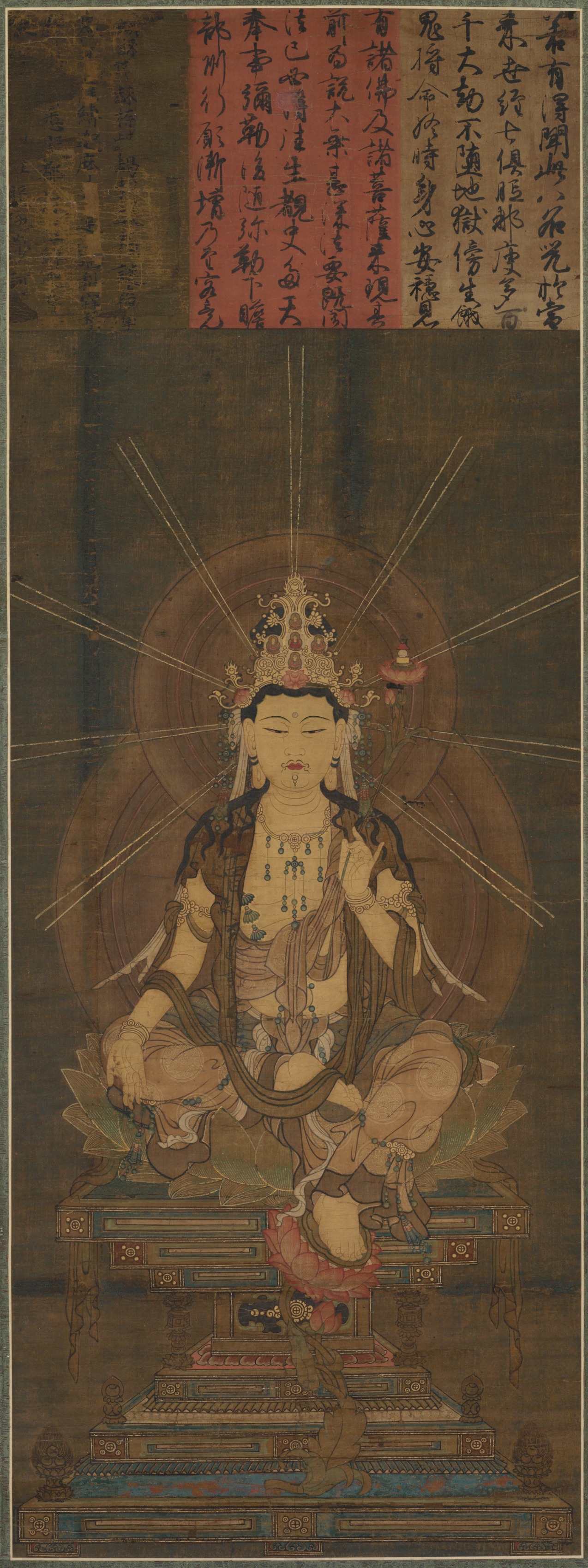 Standing frontal bodhisattva in gauzy robes and heavy jewelry, gold crown holding five small seated Buddhas, cut-gold patterning on the silk, three lines of inscription above the