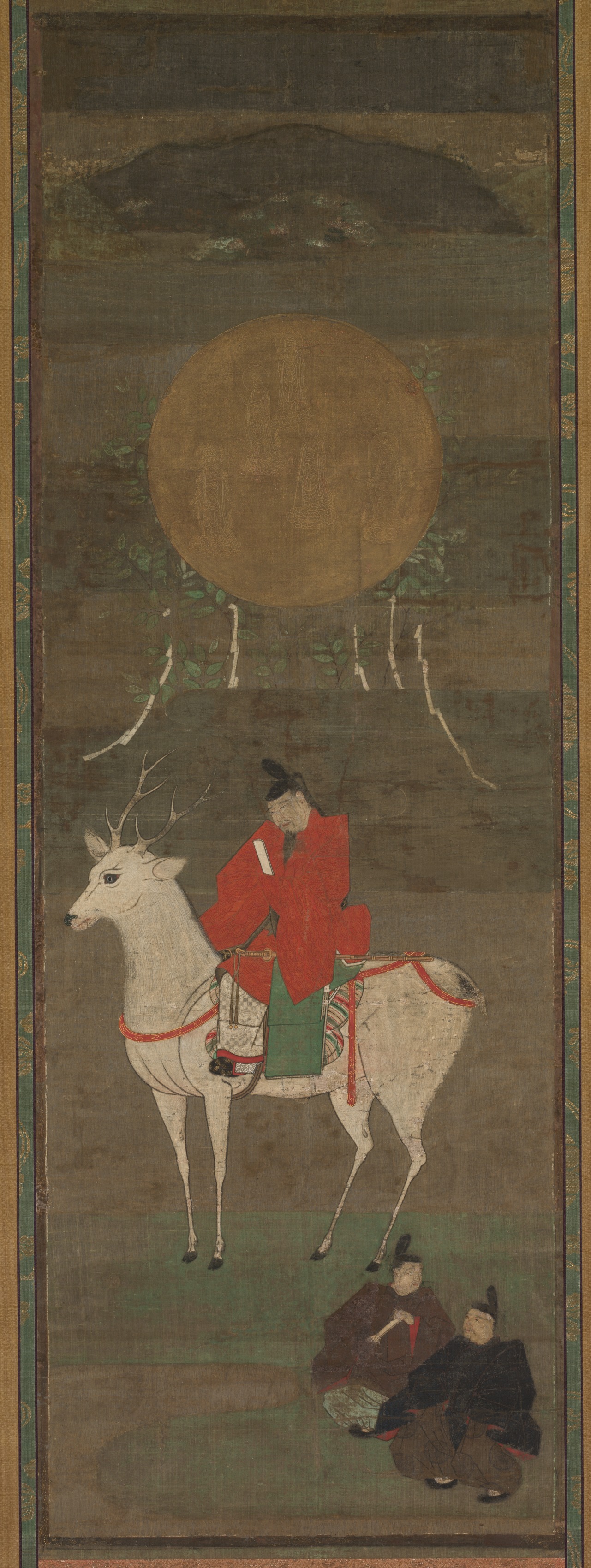 Tall scroll: a red-robed courtier in a tall black cap rides a white deer below a large gold disc with five white streamers; two small figures lower right; a dark mountain at top.