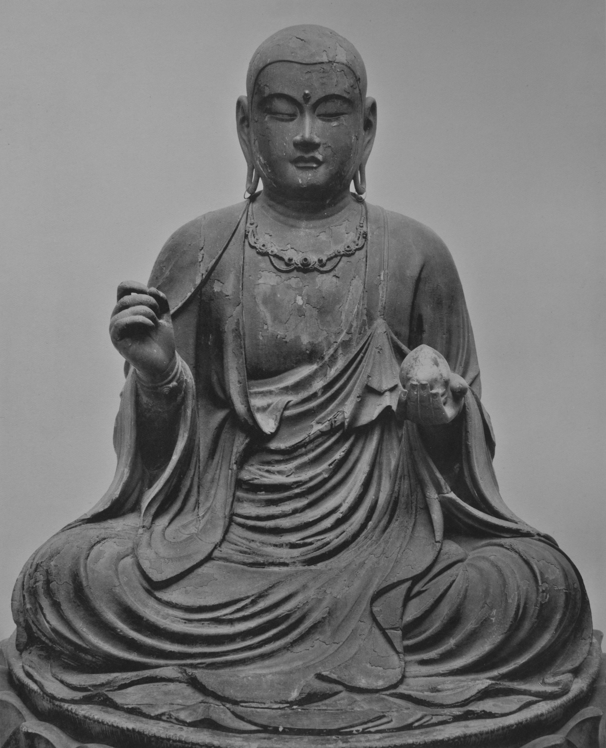 Rokuharamitsuji seated Jizō Bosatsu, Kamakura, yosegi hinoki with gyokugan, c. 90 cm. Half-lotus on a lotus throne, monastic kāṣāya, right hand raised, left lowered.