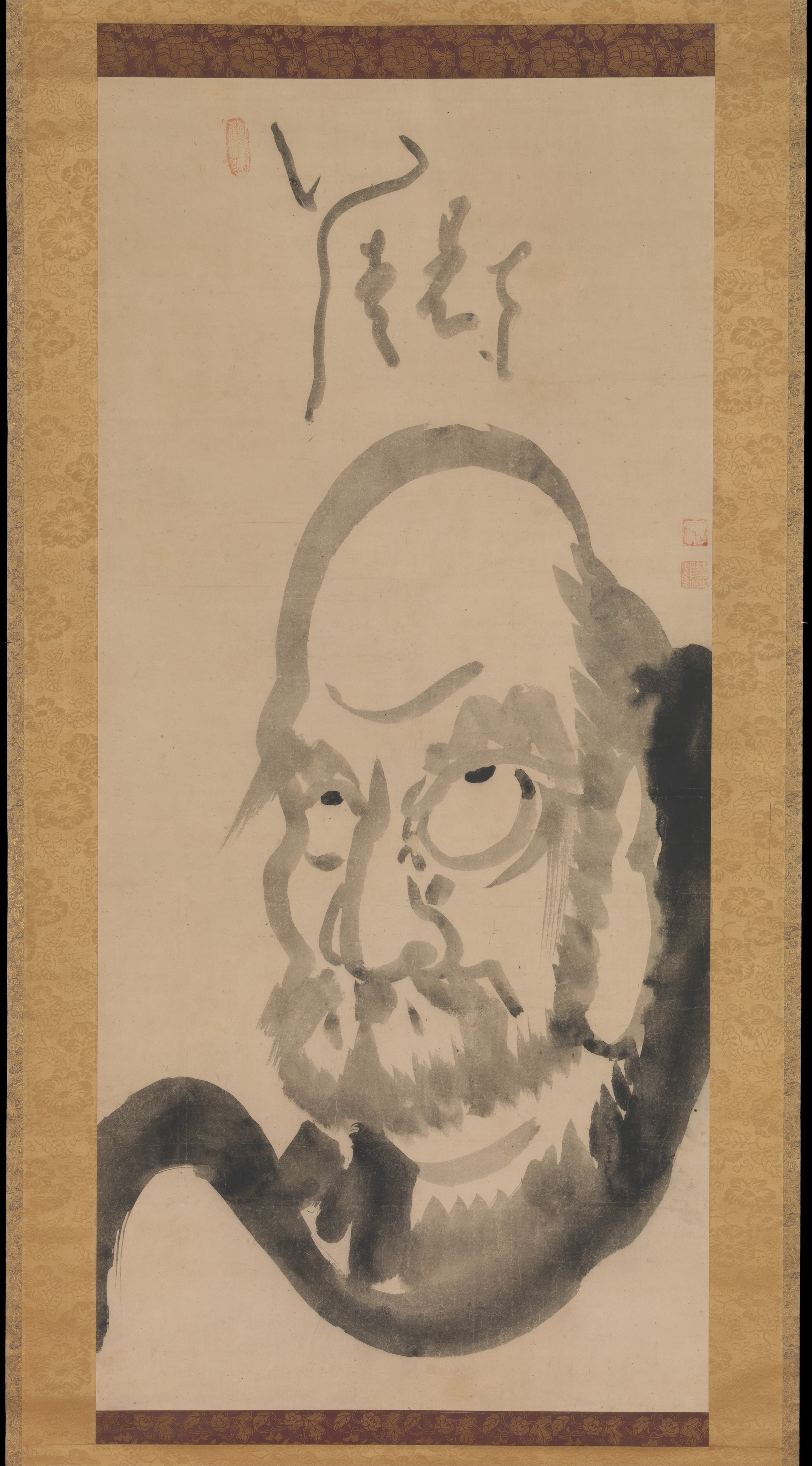 Hakuin Ekaku, Edo mid-18th c. Hanging scroll, ink on paper, 118 × 54 cm. Half-length frontal Daruma; domed bald head fills the upper third; staring wet-edged eyes.