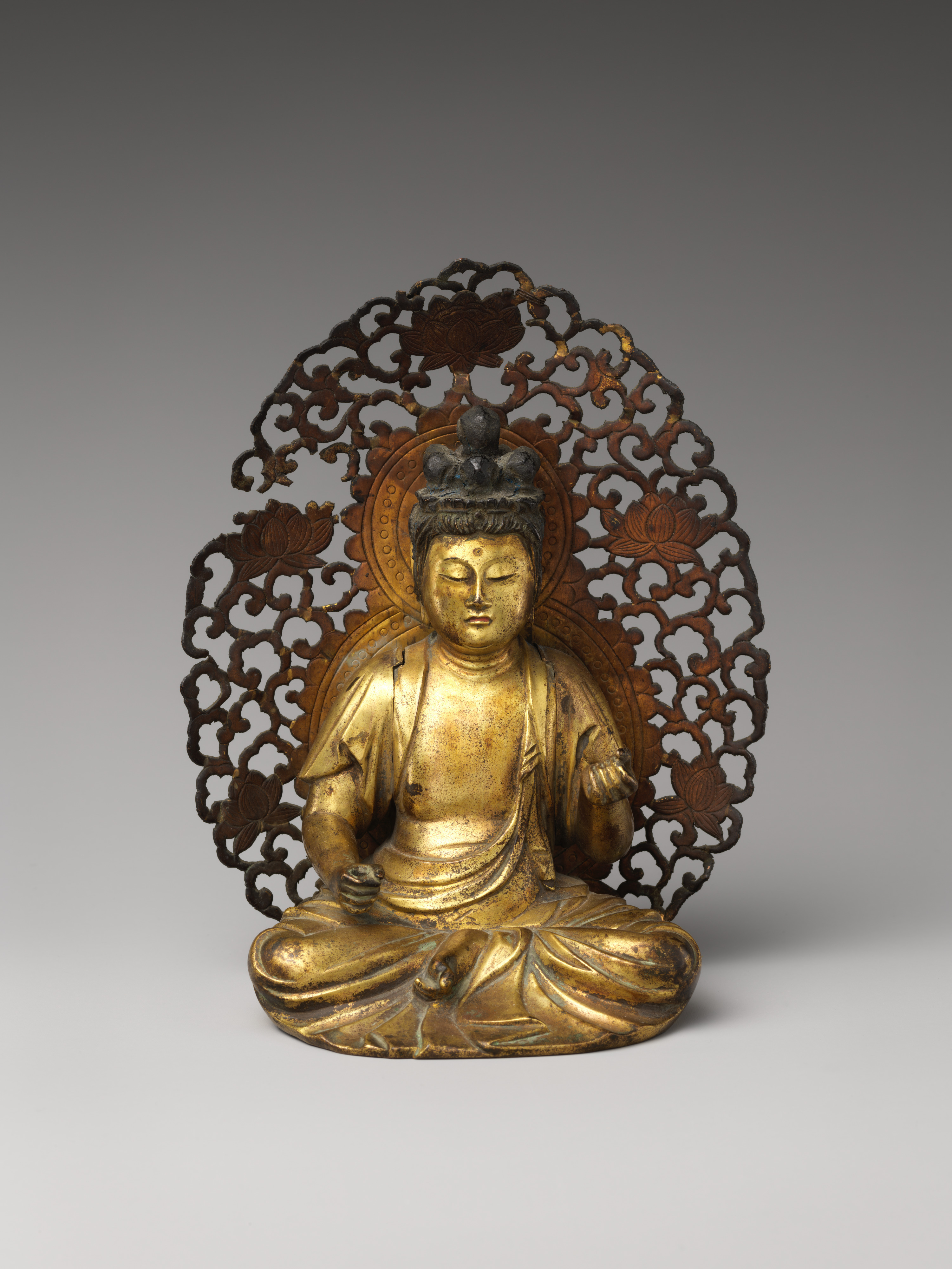 Kamakura late-13th-c. gilt-bronze seated Hachiji Monju, 16.5 cm. Eight discrete topknots around the cranium — the eight-syllable mantra form. Tangs on the back.