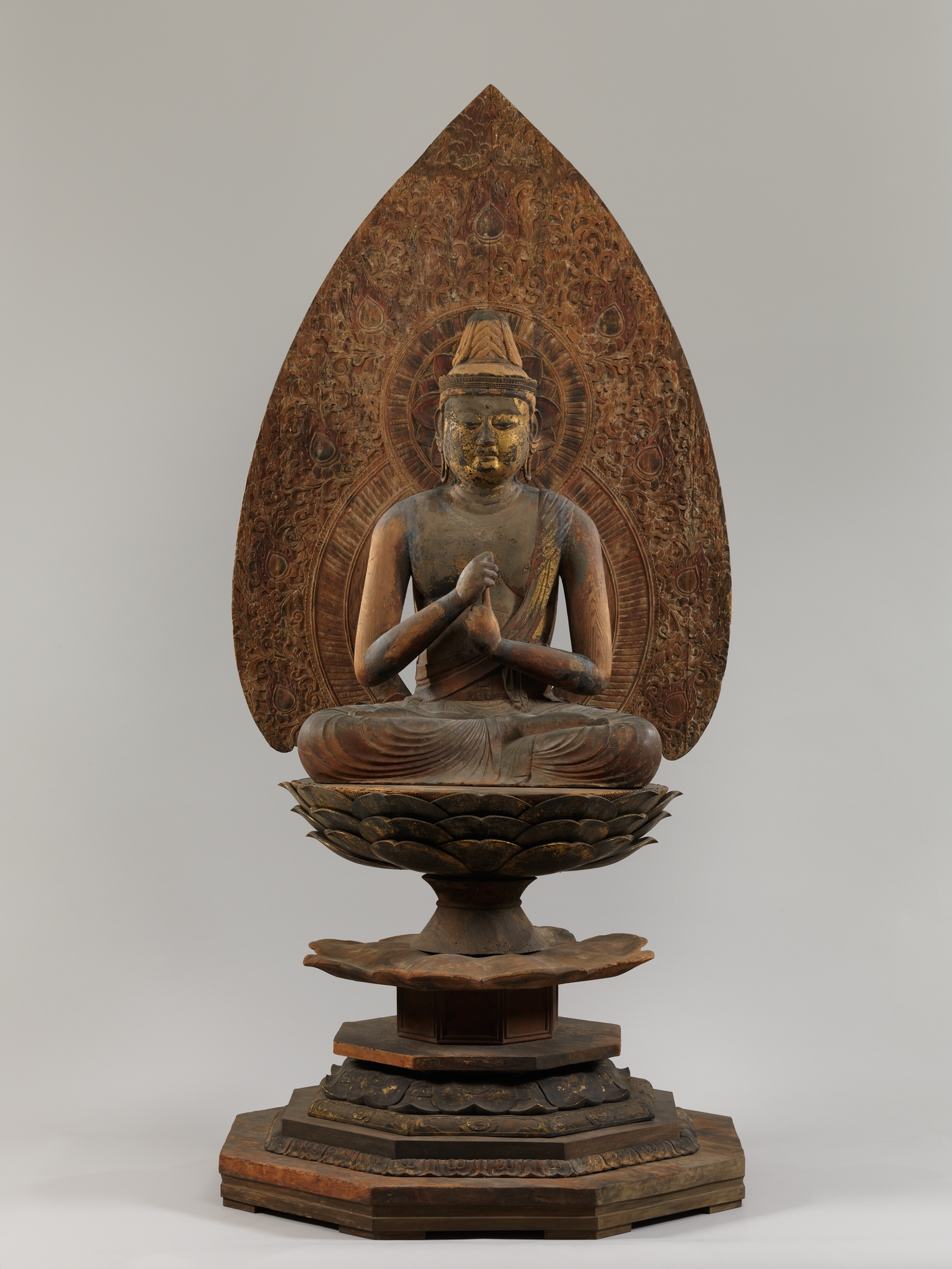 Heian 12th-c. seated Dainichi Nyorai, painted-and-lacquered wood, 92 cm (218 cm with halo). Hands in chiken-in mudra; original carved-wood mandorla intact.