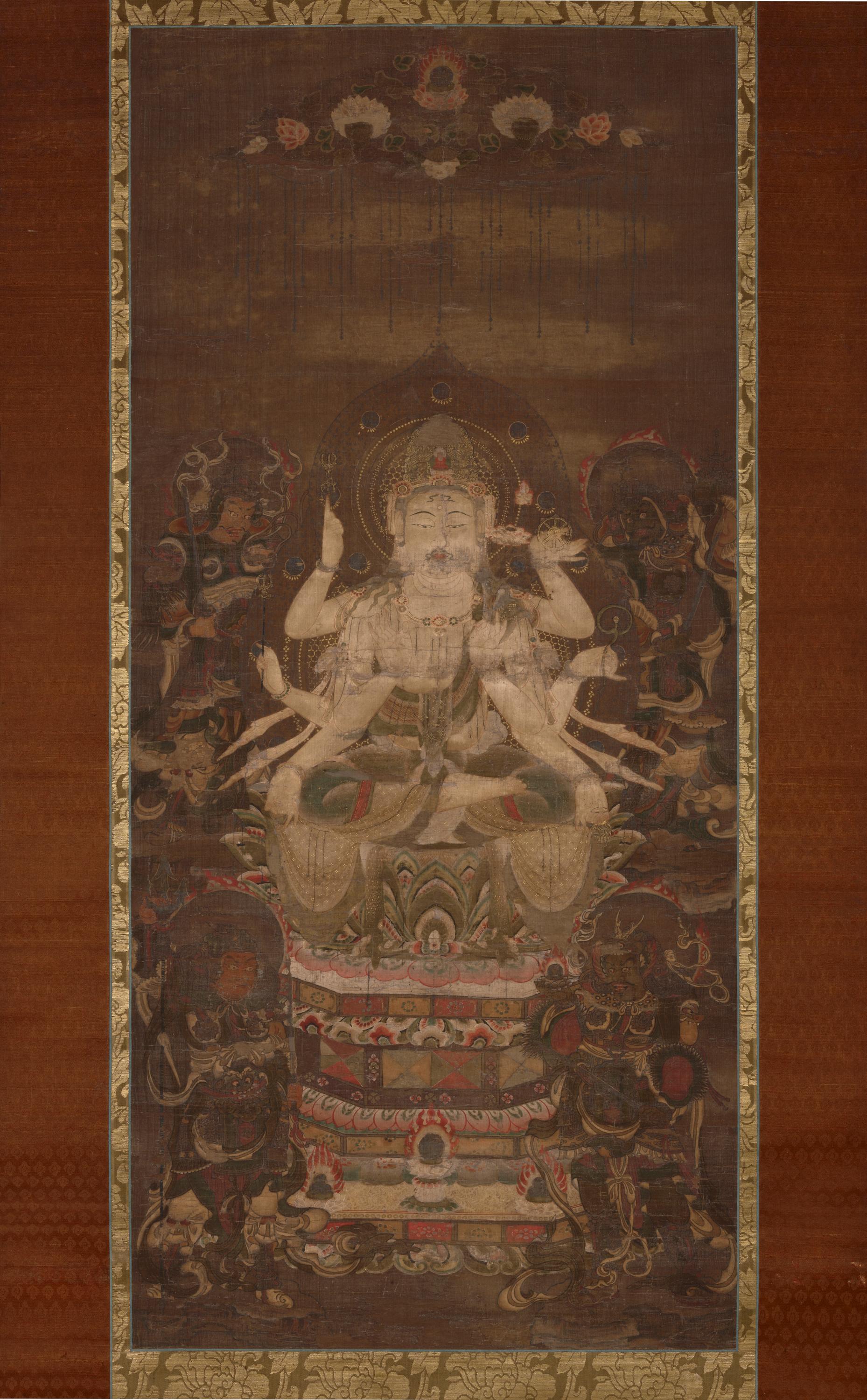 Heian 12th-c. hanging scroll, colour and kirikane on silk, 103 × 47 cm. Multi-armed seated Juntei Kannon on a lotus pedestal; four Shitennō in the corners.