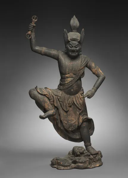 Kamakura 1200s wood Zaō Gongen with traces of red-orange polychromy, 107 cm. Single wrathful face; flame-shaped crest; right arm raises a three-pronged vajra.