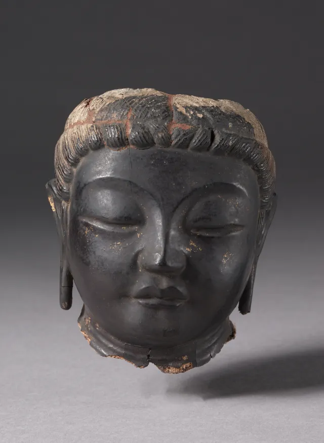 Nara dry-lacquer (kanshitsu) bodhisattva head, 700s, 13.7 cm. Cleanly broken at neck and crown; downcast eyes, full cheeks, traces of gilding on dark lacquer.