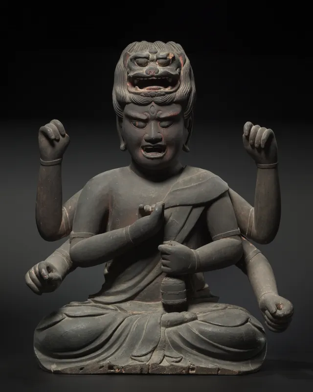 Kamakura six-armed Aizen Myōō, wood with black lacquer and red pigment, early 1300s, 75 cm. Lion-head crown projecting from the topknot; six empty hands.