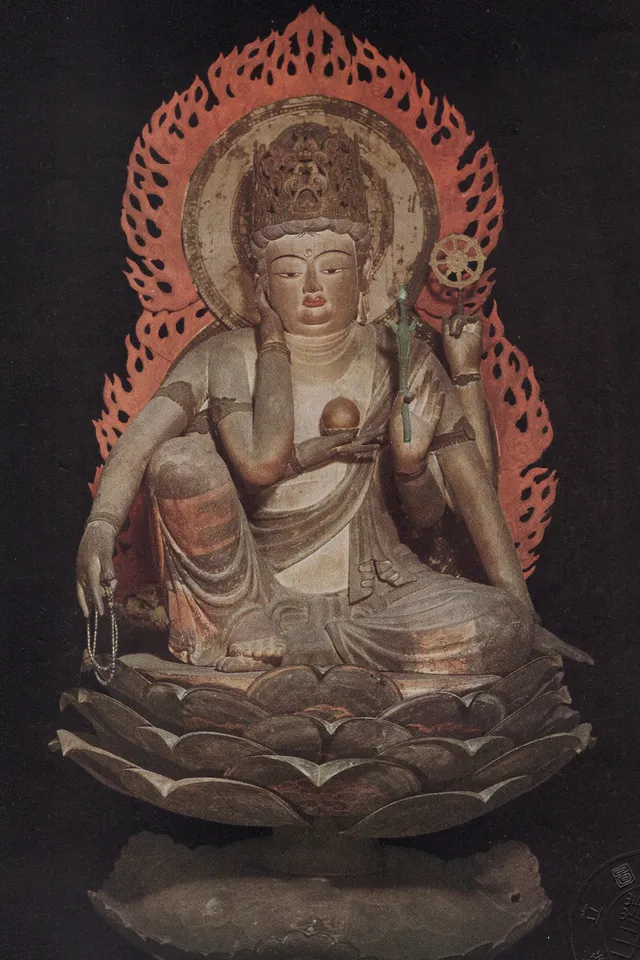 Kanshin-ji six-armed seated Nyoirin Kannon, Heian 9th c., single-block lacquered wood. Royal-ease posture; right hand at the cheek in shiyui-in; cintāmaṇi and wheel.