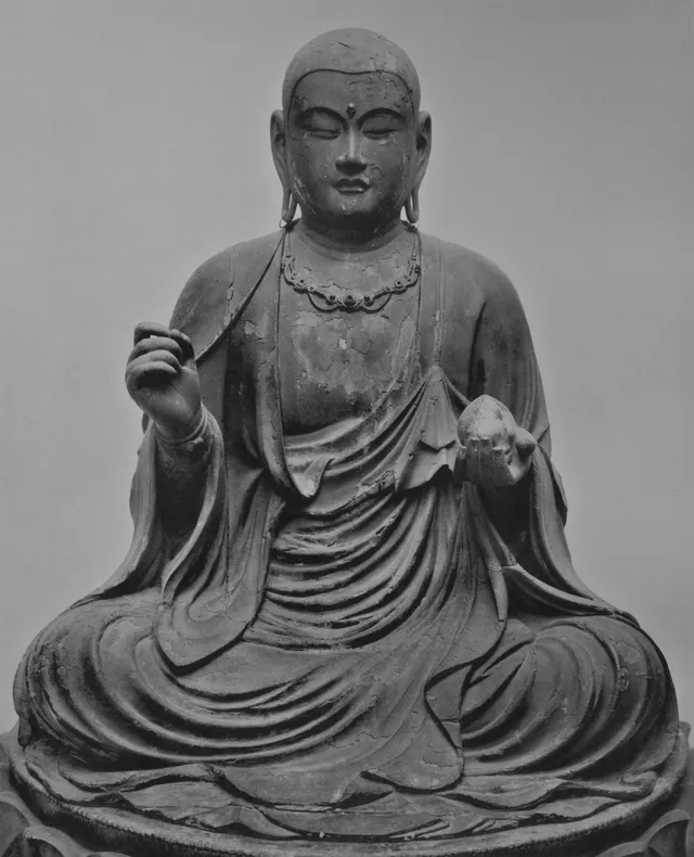 Rokuharamitsuji seated Jizō Bosatsu, Kamakura, yosegi hinoki with gyokugan, c. 90 cm. Half-lotus on a lotus throne, monastic kāṣāya, right hand raised, left lowered.