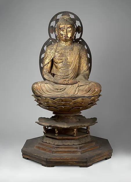 Kamakura standing wood Amida Buddha, c. 1250, 88 cm (155 cm with pedestal). Right hand raised, left lowered in raigō-in mudra; carved multi-tier lotus base.
