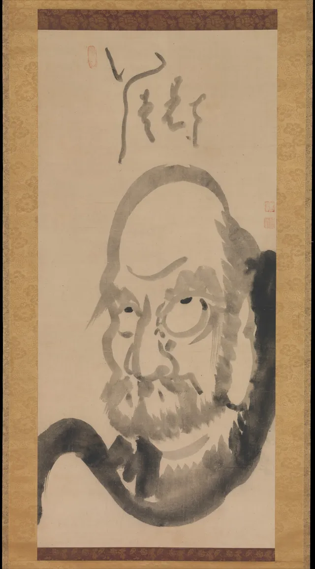 Hakuin Ekaku, Edo mid-18th c. Hanging scroll, ink on paper, 118 × 54 cm. Half-length frontal Daruma; domed bald head fills the upper third; staring wet-edged eyes.