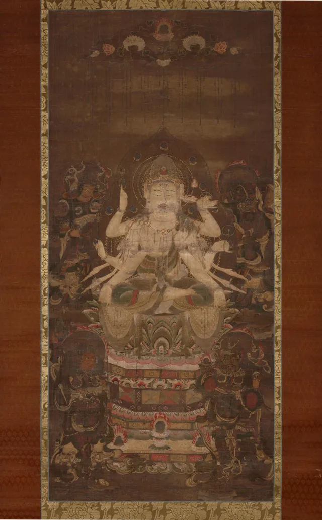 Heian 12th-c. hanging scroll, colour and kirikane on silk, 103 × 47 cm. Multi-armed seated Juntei Kannon on a lotus pedestal; four Shitennō in the corners.